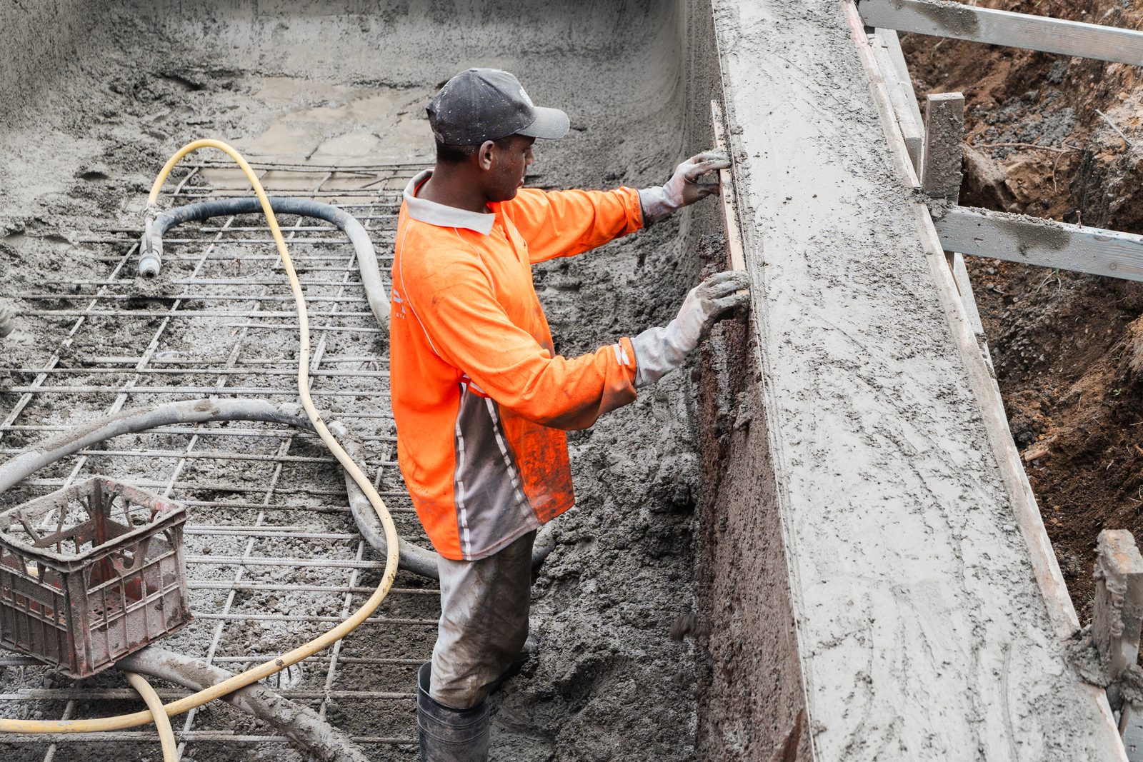 Shotcrete placed to a below-ground retaining wall inside an excavation