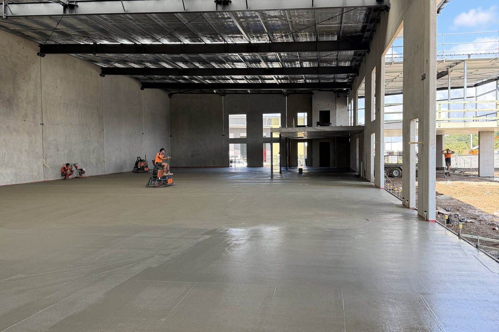 A commercial slab placed and finished by line pump