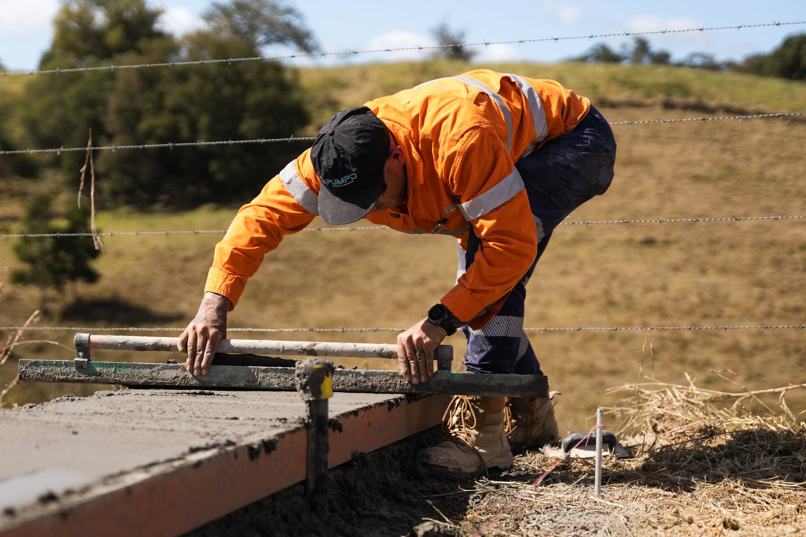 A Pumpd crew screeding a poured kerb and channel