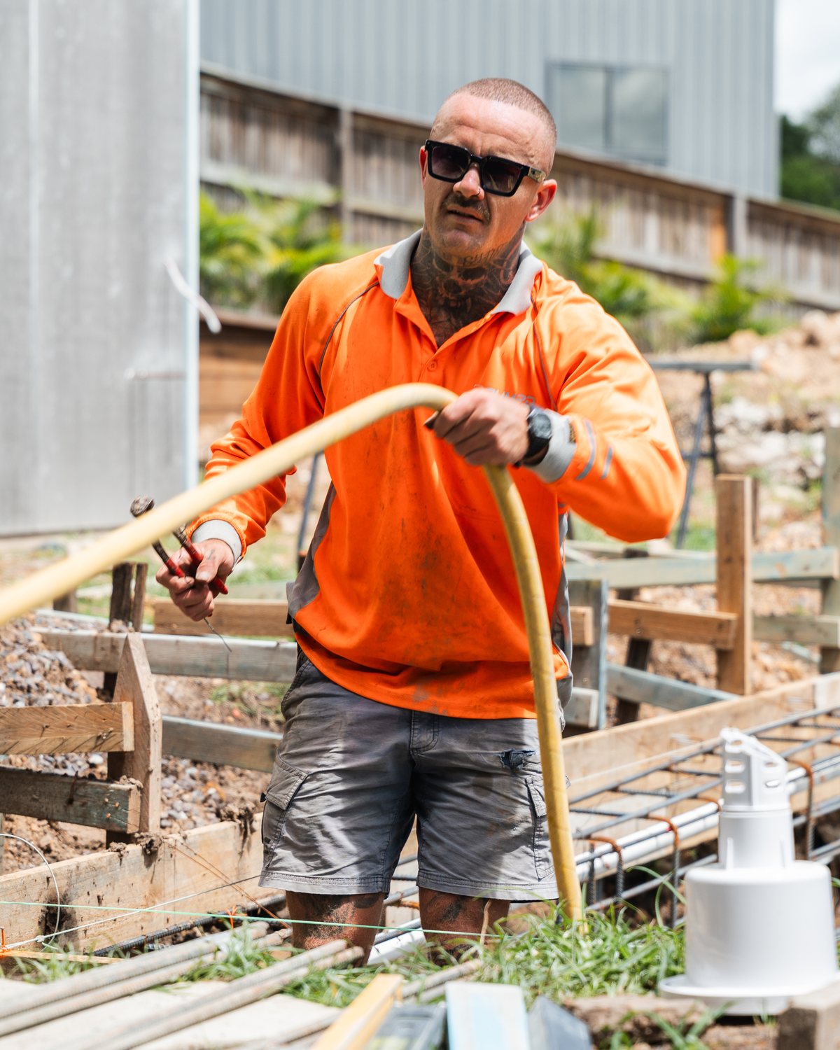 A Pumpd operator running the line onto a residential slab